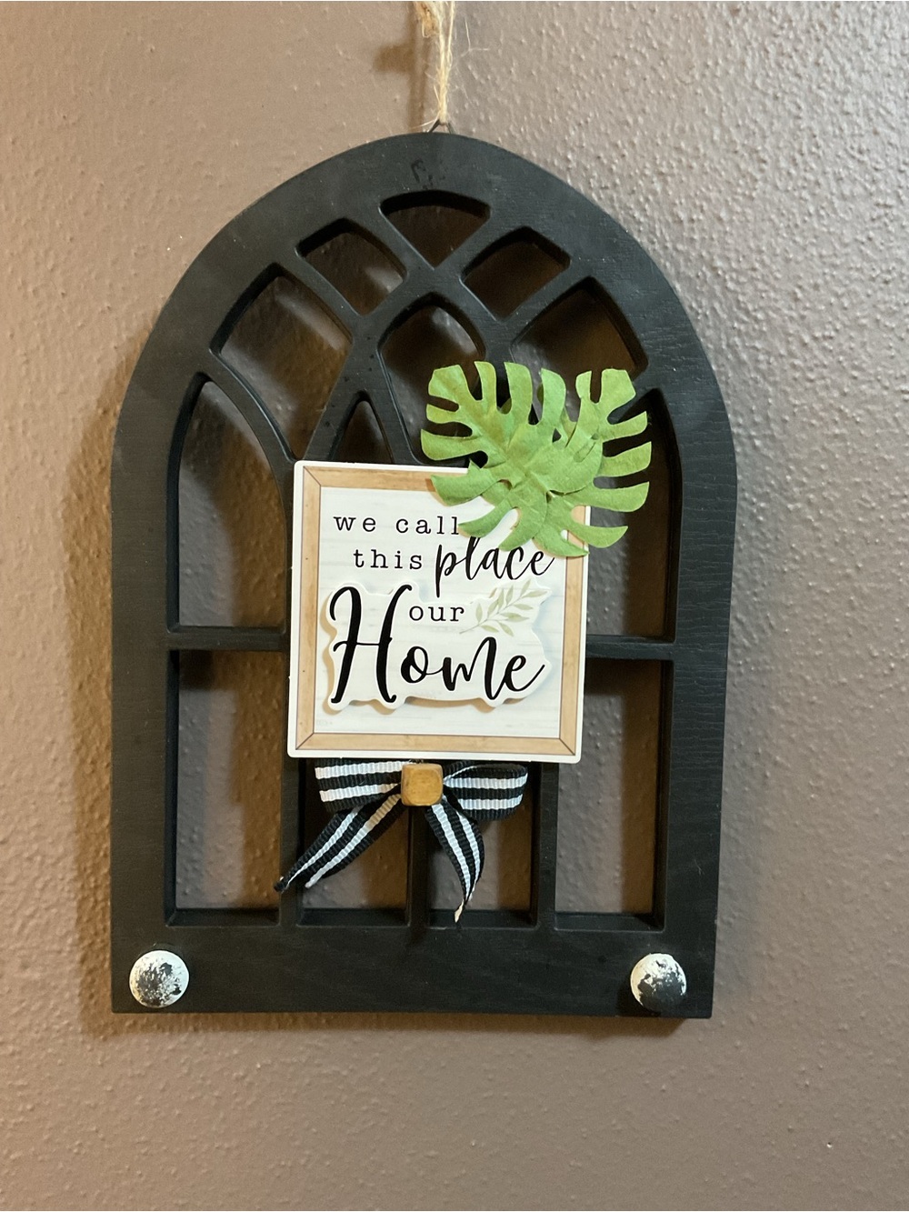 Black 'We Call This Place Our Home' Wall Decor with Green Leaf Accent